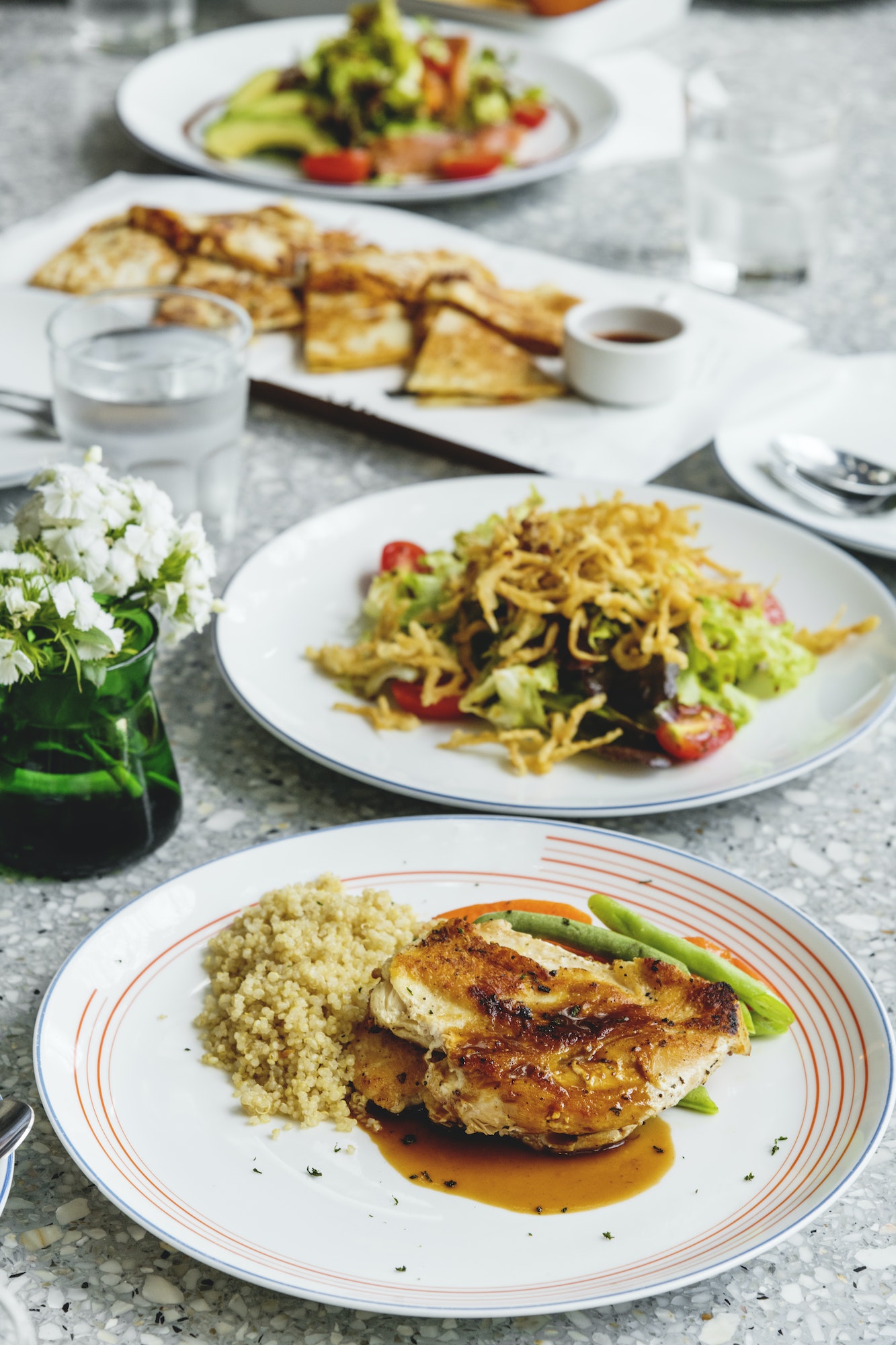 Grilled chicken with quinoa and green beans.